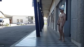 fully naked man masturbates out of a public cinema in daylight